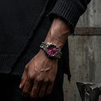 Purple-dial Void watch worn on a wrist with a black sleeve