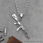 Street AK pendant and ball chain displayed on a gray background