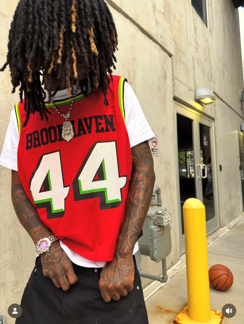 A purple-dial Klaw watch styled with a red basketball jersey